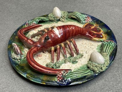Deux plats en barbotine à décor de homard....