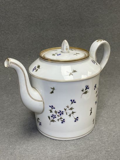 Théière et deux tasses en porcelaine décor...