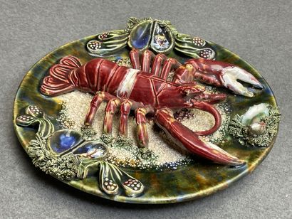 Deux plats en barbotine à décor de homard....