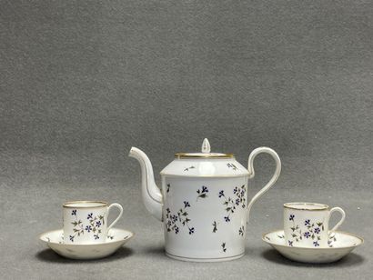 Théière et deux tasses en porcelaine décor...