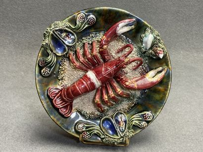 Deux plats en barbotine à décor de homard....