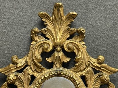 Miroir cadre en bois doré ajouré
Italie XIX°...