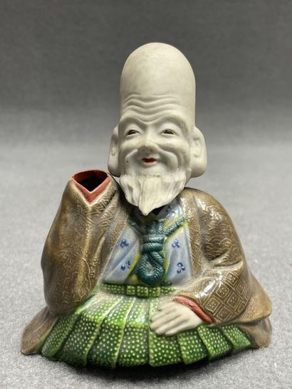 Lot comprenant: 
Personnage en porcelaine,...