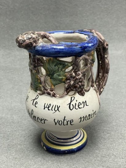 Pichet trompeur et assiette en faïence marquée...