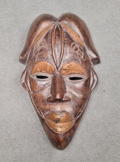 Collection de quatre masques africains 
H:...