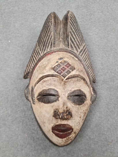 Collection de quatre masques africains 
H:...