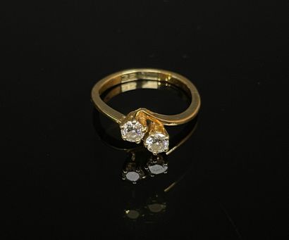 Gold ring set with two diamonds, approx....