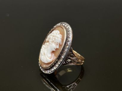 Gold and silver ring, cameo, surrounded by...