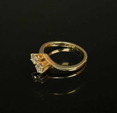 Gold ring set with two diamonds, approx....