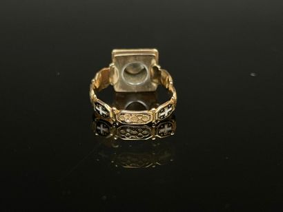Black enameled gold ring set with a brilliant...