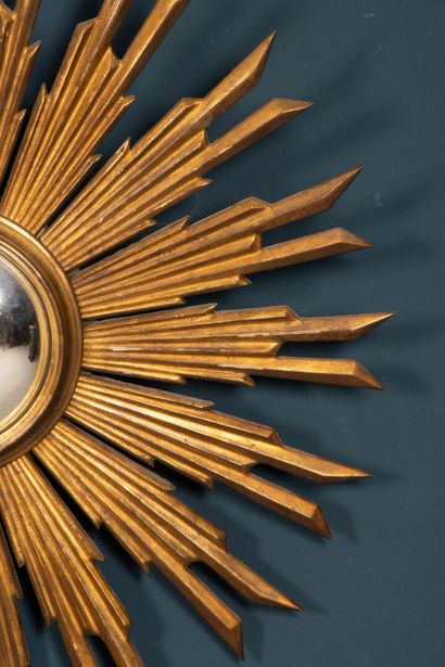 Carved and gilded wood sunburst witch mirror.
20th...