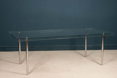 Glass table, chrome-plated metal legs. 
74...
