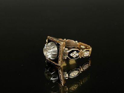 Black enameled gold ring set with a brilliant...