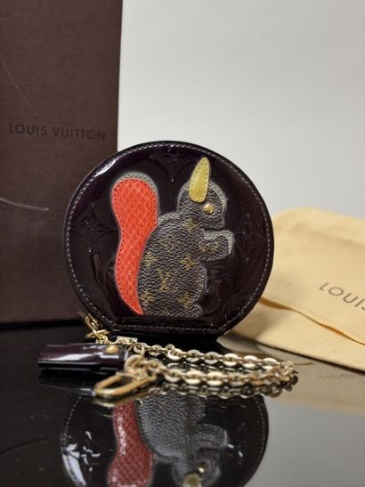 LOUIS VUITTON
Chromed brown round purse with...