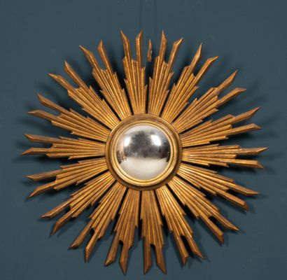 Carved and gilded wood sunburst witch mirror.
20th...