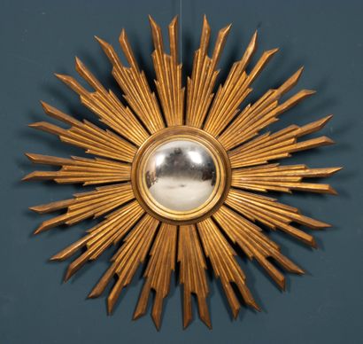 Carved and gilded wood sunburst witch mirror.
20th...