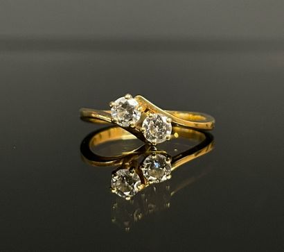 Gold ring set with two diamonds, approx....