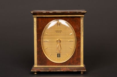 HERMÈS Paris. 
Travel clock in gilt metal...