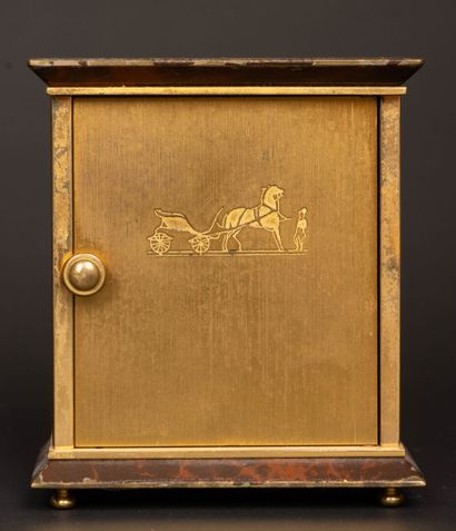 HERMÈS Paris. 
Travel clock in gilt metal...
