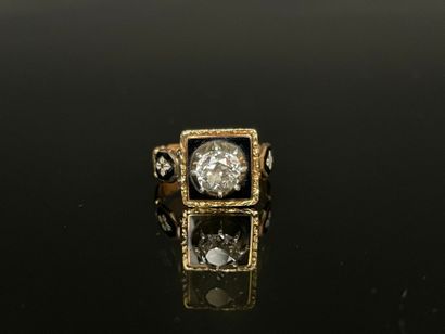 Black enameled gold ring set with a brilliant...