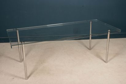 Glass table, chrome-plated metal legs. 
74...