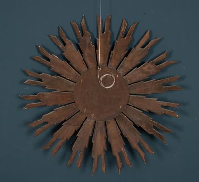 Carved and gilded wood sunburst witch mirror.
20th...