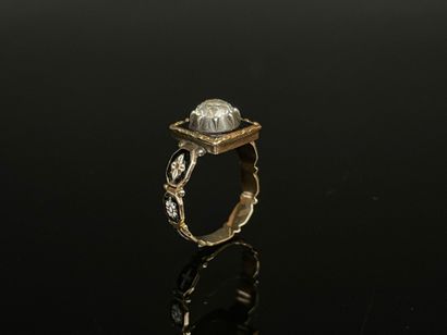 Black enameled gold ring set with a brilliant...