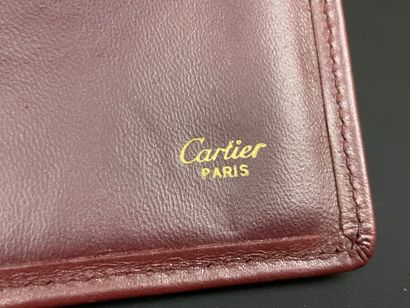 CARTIER: Bordeaux leather organizer.
Warranty...
