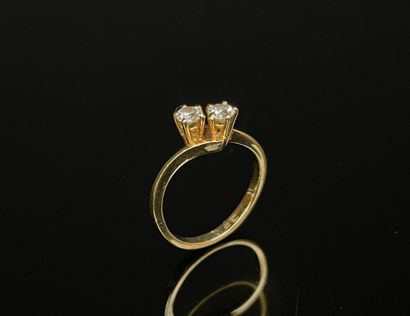 Gold ring set with two diamonds, approx....