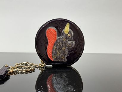 LOUIS VUITTON
Chromed brown round purse with...