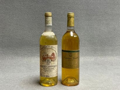 2 bouteilles: 
-Chateau Carbonnieux, 1993....