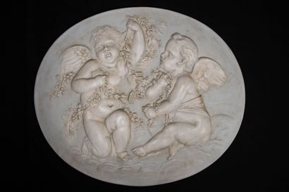 Suite of four bas-relief medallions, in patinated...