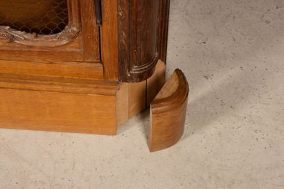 Large molded oak bookcase, opening to three...
