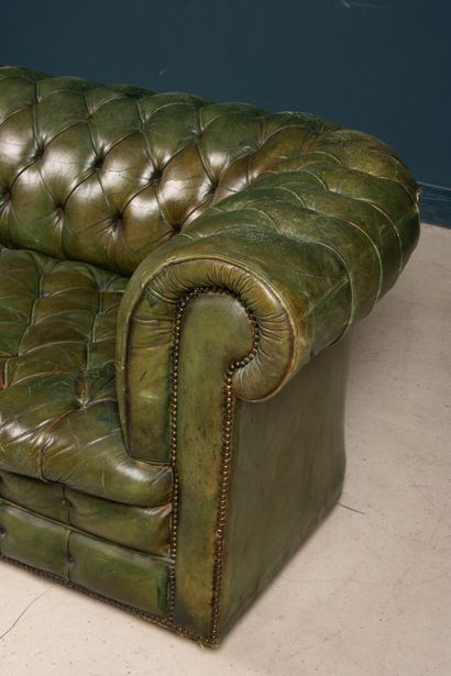 Green leather upholstered Chesterfield sofa.
Early...