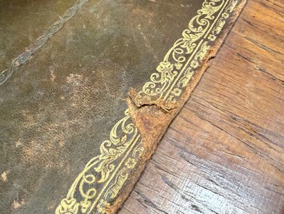 Inlaid flat desk opening to three drawers.
Transitional...