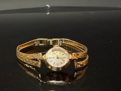 OMEGA Montre de dame en or 750°/00.
Bracelet...
