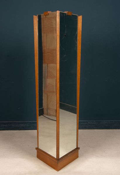 Three-sided boutique column mirror. 
Circa...