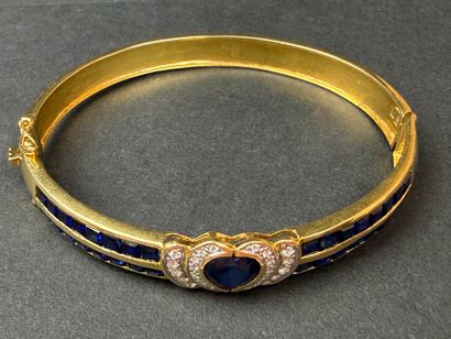 Bracelet jonc en or, serti de pierres bleues...