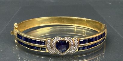 Bracelet jonc en or, serti de pierres bleues...