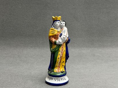 Saint Vierge. 
Statuette en faïence signée...