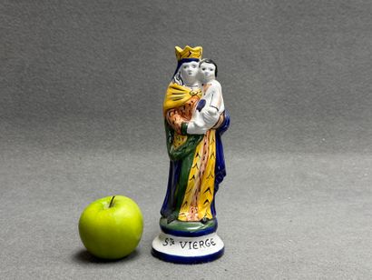Saint Vierge. 
Statuette en faïence signée...