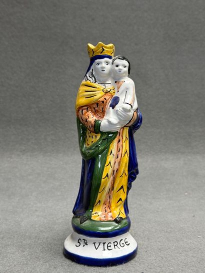 Saint Vierge. 
Statuette en faïence signée...
