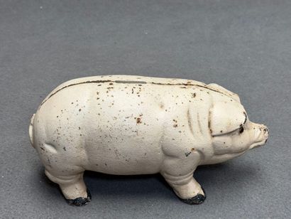 Tirelire cochon en fonte.
Début XX°
L: 26...