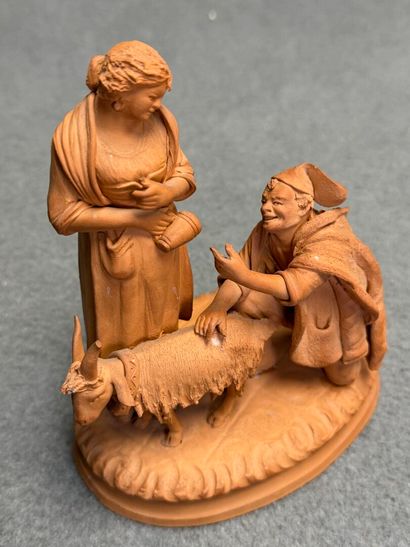 Couple et chèvre. 
Groupe en terre cuite...