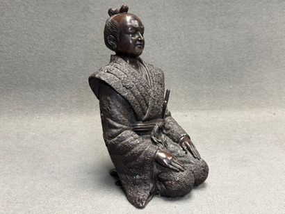 Samouraï à genoux. 
Sculpture décorative...