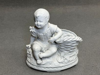 Pot en biscuit à décor de bébé vers 1900....