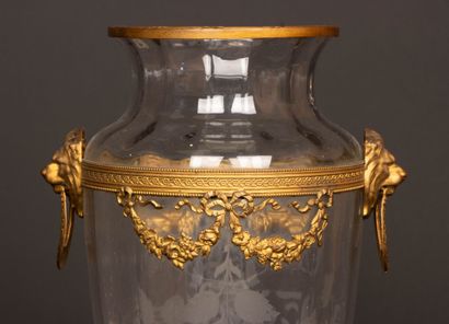 Engraved glass vase with brass frame decorated...