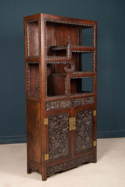 Richly carved exotic wood shelf with two...