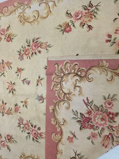 Hand-woven wool rug decorated with flowers...