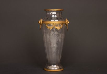 Engraved glass vase with brass frame decorated...